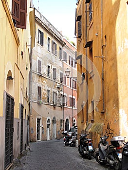 Row of the motorcycles on the old street in Roma