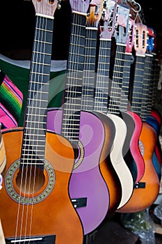 Row of multi-colored mexican guitars