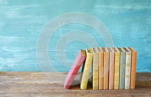 Row of multicolored books, free copy space. Reading, education, literature, learning, book fair concept