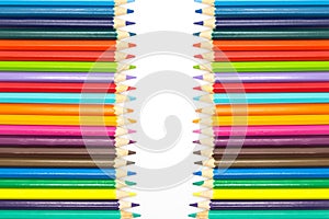 Row of multiple colors wooden pencils, on white background