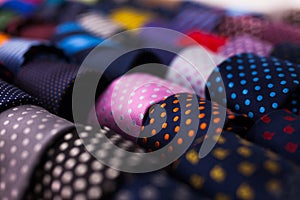 Row of Neckties on hangers in men clothing store