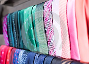 Row of Neckties on hangers in men clothing store