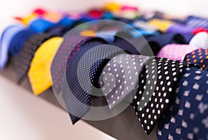 Row of Neckties on hangers in men clothing store