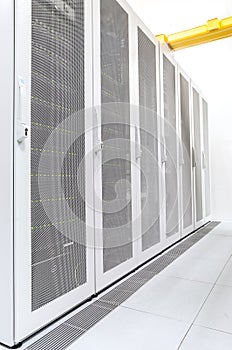 Row of network servers in datacenter room