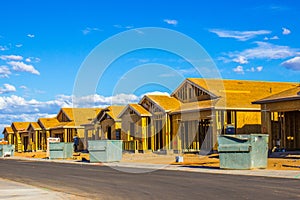 Row Of New Homes Under Construction In Subdivision