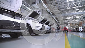 Row of new shiny passenger cars at factory ready export or import over sea. Many similar new modern shiny cars standing