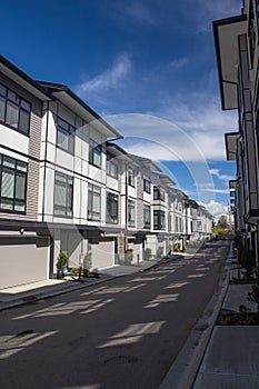 A row of a new townhouses. External facade of a row of colorful modern urban townhouses.brand new houses just after construction o
