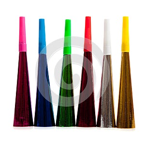 Row of noise makers on white