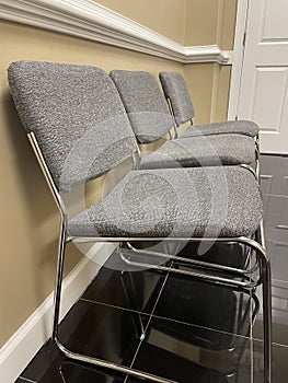 A row of office lobby waiting chairs