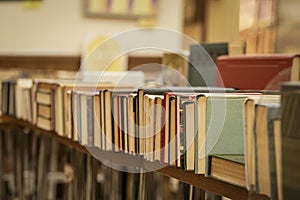 Row of old books on tables in book store, library. Education, hobby, reading f concept