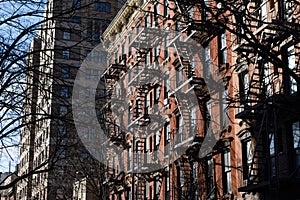 Row of Old Brick Apartment Buildings with Fire Escapes in Greenwich Village of New York City