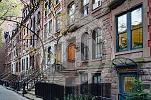 row of old brownstone townhouses