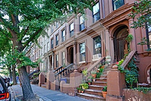 row of old brownstone townhouses