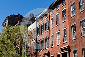 Row of Old Colorful Brick Residential Buildings along a Street in Greenwich Village of New York City