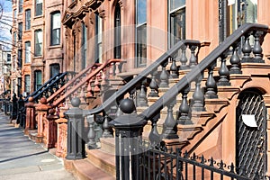 A Row of Old Colorful Brownstone Townhouses with Stairs in Fort Greene Brooklyn New York