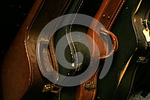 A Row of Old Guitar Cases photo