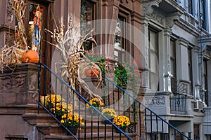 A Row of Old Houses on the Upper West Side in New York City with Autumn Decorations