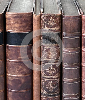 Row of old leather bound books