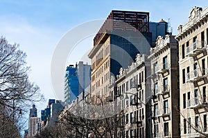 Row of Old Residential Buildings with Fire Escapes in Harlem of New York City