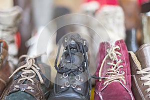 A row of old shoes on a flea market