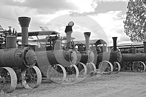 Row of old steam engines (black and white)