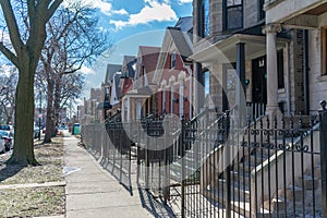 A Row of Fenced In Homes in Logan Square Chicago photo
