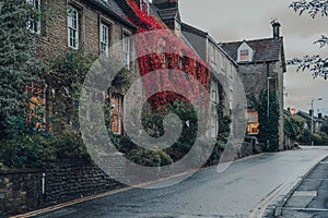 Row of old stone houses with colourful foliage in Frome, Somerset, UK