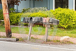 Row of old traditional american letter boxes along of a Long Grove road