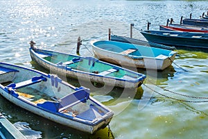 Row of old vintage colorful boats on the lake of Enghien les Bains near Paris France