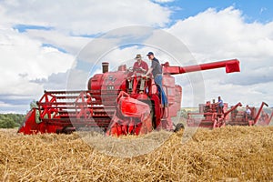 A row old vintage Massey Ferguson combine harvesters