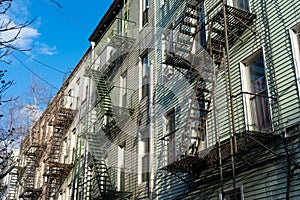 Row of Old Wood Residential Buildings with Fire Escapes in Williamsburg Brooklyn New York photo