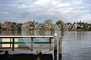 A row of old world Dutch architecture homes line the canal.