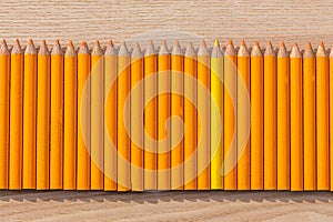 Row of orange and yellow pencil