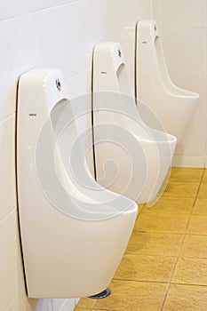 Row of outdoor urinals men public toilet,Closeup white urinals i