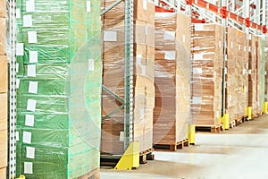 Row of package boxes in modern warehouse