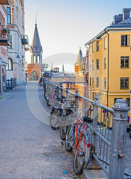 Row of parked Bikes, bicycles near railing, Stockholm, Sweden