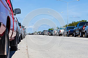 Row of parked cars in parking lot