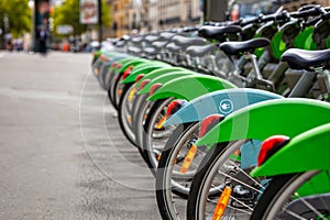 Row of parked electric bikes for rent, Paris. France