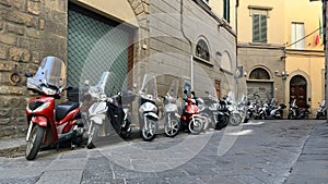 Row of Parked Scooters in an Alley in Rome