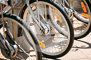 Row of parked vintage bicycles bikes for rent on