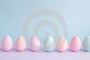 a row of pastel colored easter eggs on a blue and purple background