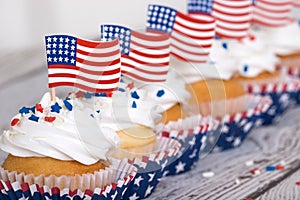 Row of patriotic cupcakes with American flags