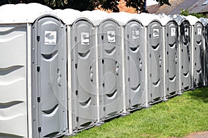 Row of portable outside toilets.