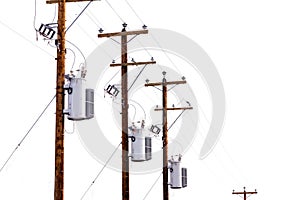 Row of power pole transformers isolated on white