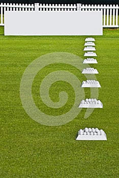 Row of Practice Balls, Blank Signage Boards photo
