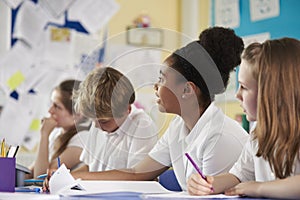 A row of primary school children in class, close up photo