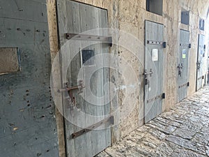 A row of prison cell doors at Fort Teremba