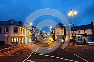 Row of pubs and bars in the city of Ballycastle, Causeway coast in Northern Ireland, UK in the evening