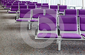 Row of purple chair at airport