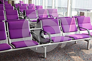 Row of purple chair at airport